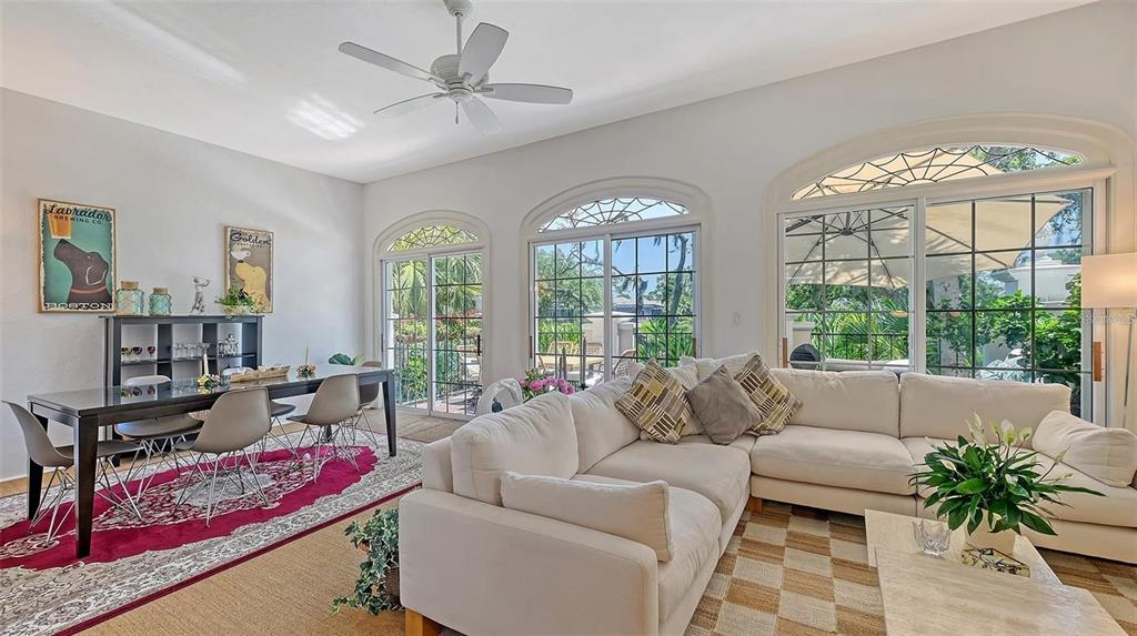 33 Bishopscourt Road, Unit 118 Osprey, FL 34229 - Photo 7 of 69 a living room with furniture and a large window