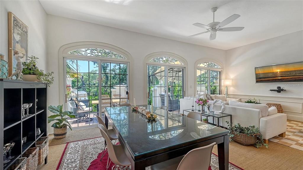 33 Bishopscourt Road, Unit 118 Osprey, FL 34229 - Photo 8 of 69 a view of a dining room with furniture window and outside view