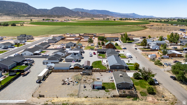 4296 Maple Lane Cedar City, UT 84721 - Photo 44 of 44 Aerial perspective showcasing a residential community with paved streets and surrounding agricultural fields