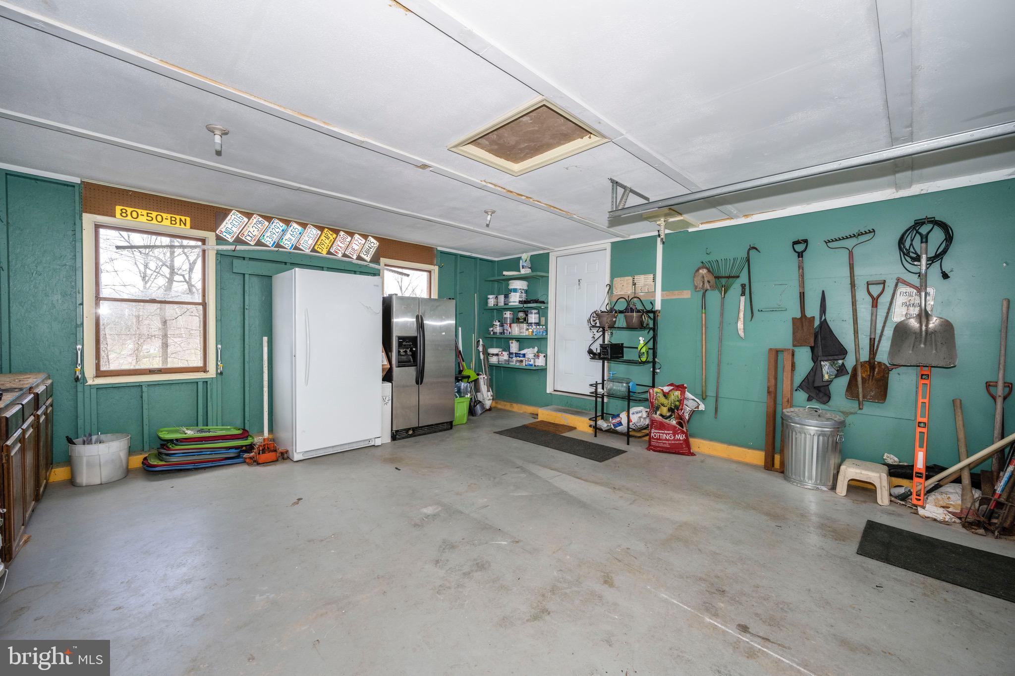 3609 Roop Road New Windsor, MD 21776 - Photo 47 of 72 Vibrant Garage, w/ plenty of workspace