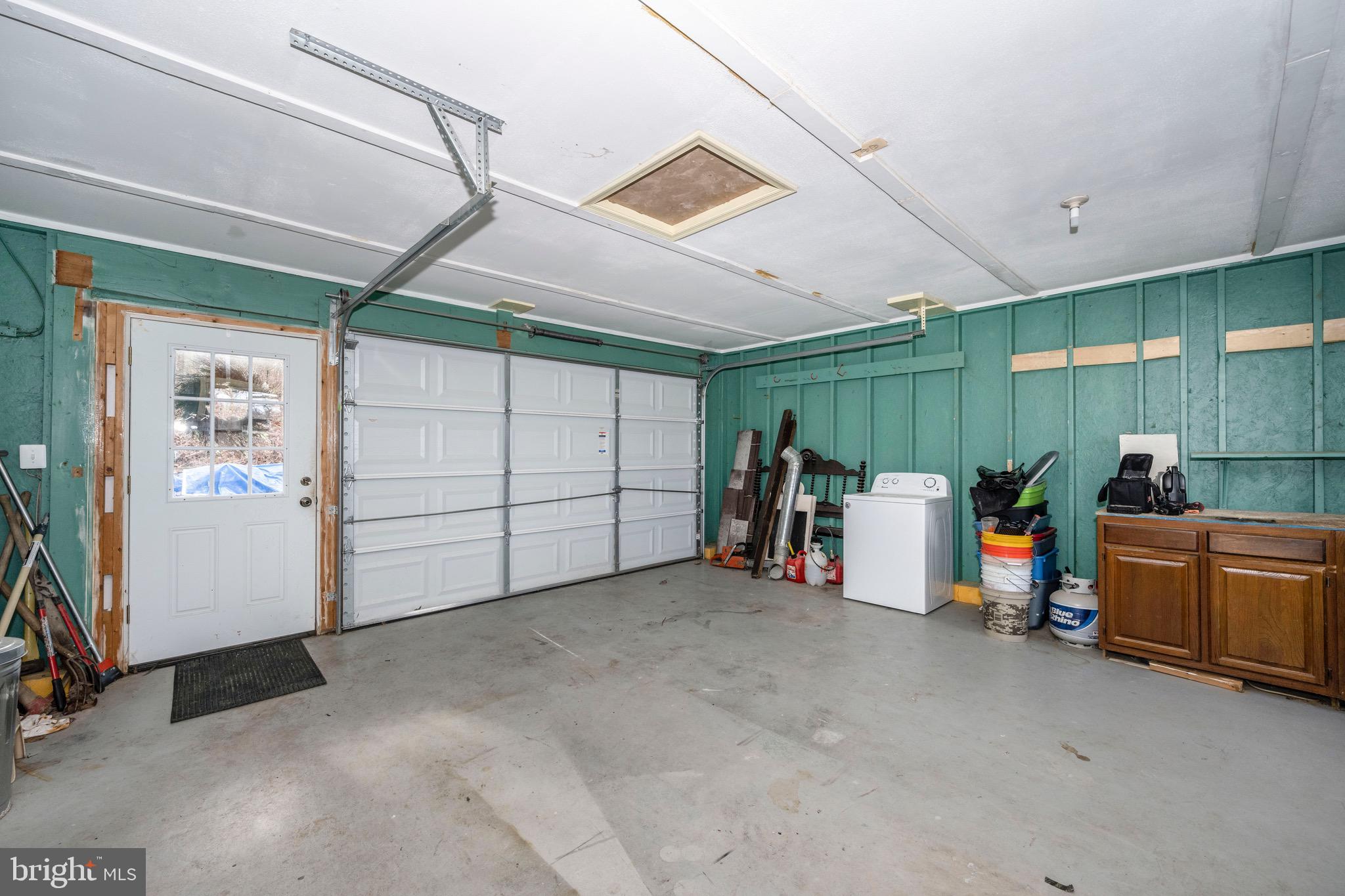 3609 Roop Road New Windsor, MD 21776 - Photo 49 of 72 Vibrant Garage, w/ plenty of workspace