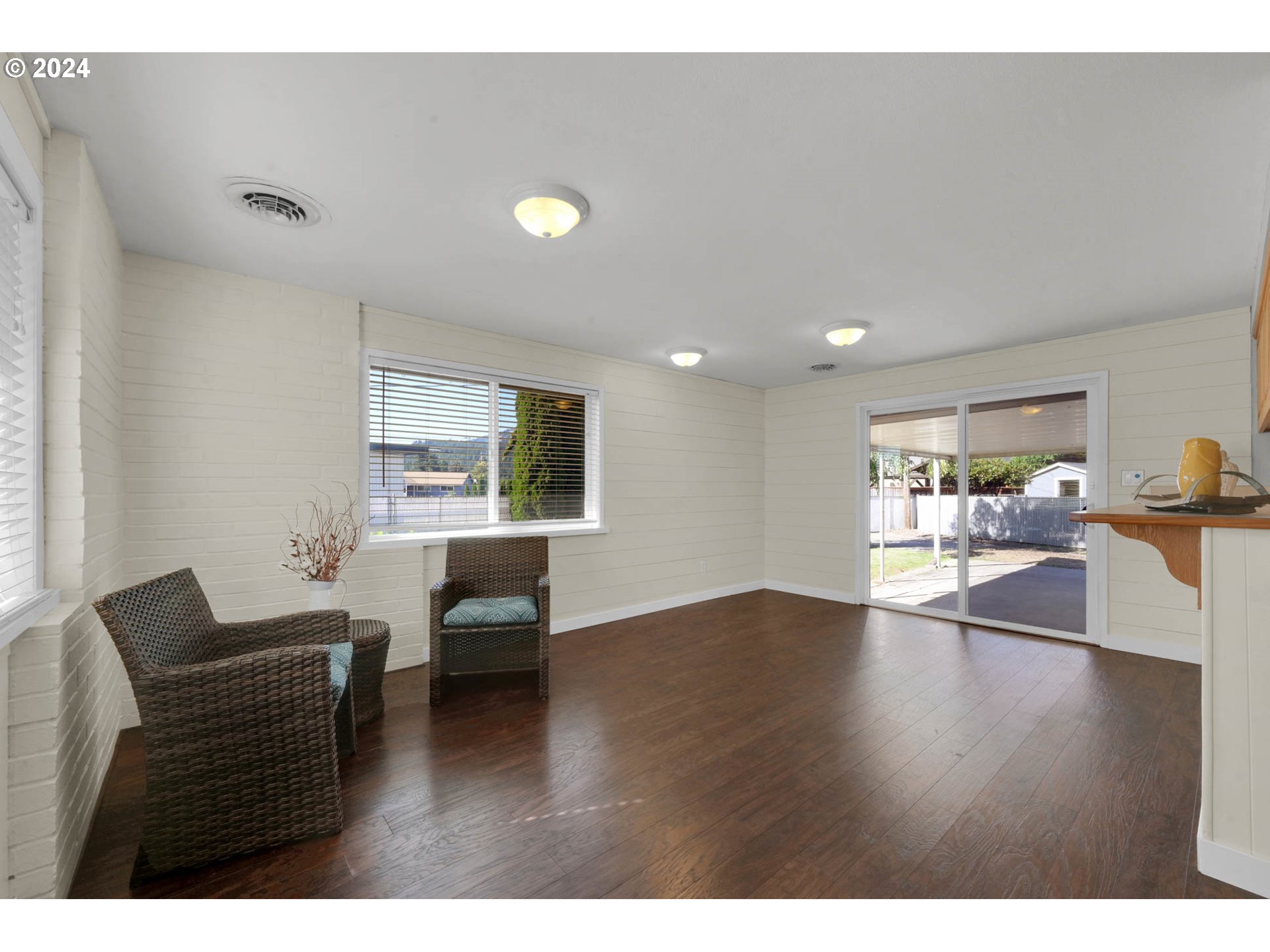 2466 Corral Court Springfield, OR 97477 - Photo 11 of 28 a living room with furniture and a wooden floor