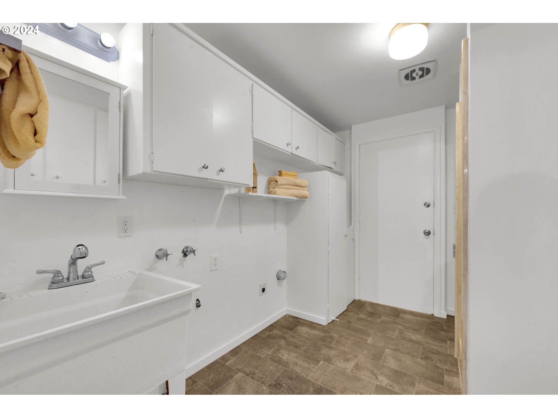 2466 Corral Court Springfield, OR 97477 - Photo 21 of 28 a kitchen with stainless steel appliances white cabinets and a sink