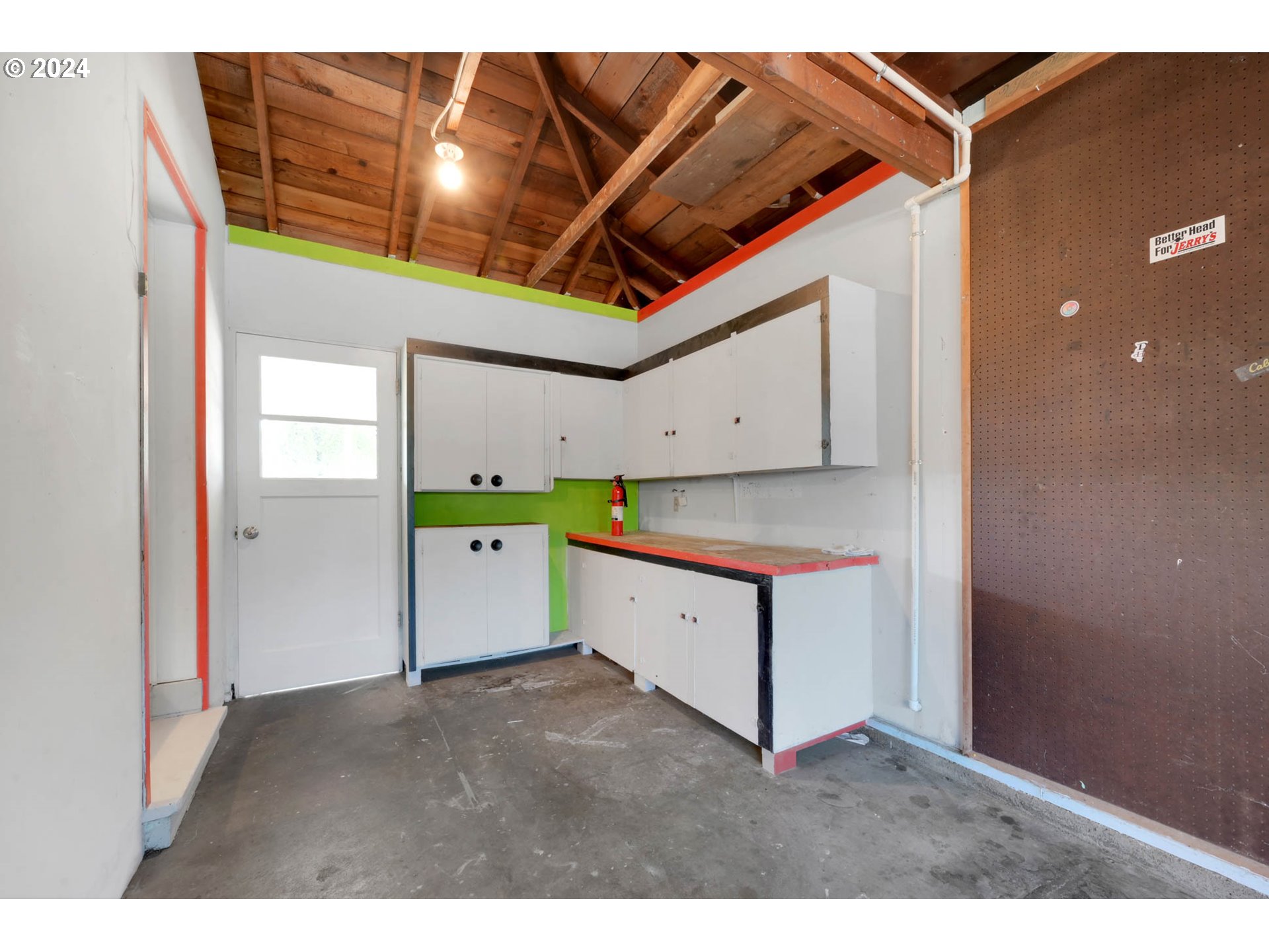 2466 Corral Court Springfield, OR 97477 - Photo 27 of 28 a kitchen with a cabinets and chandelier