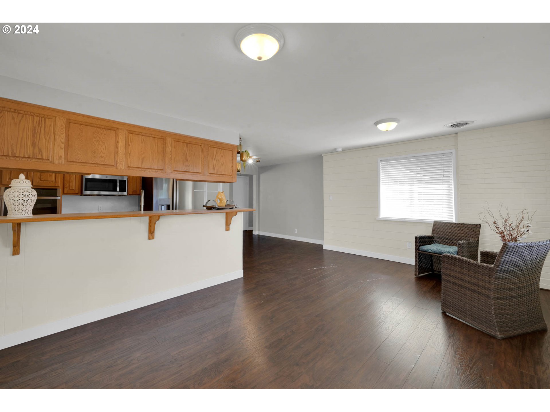 2466 Corral Court Springfield, OR 97477 - Photo 10 of 28 a living room with furniture and a wooden floor