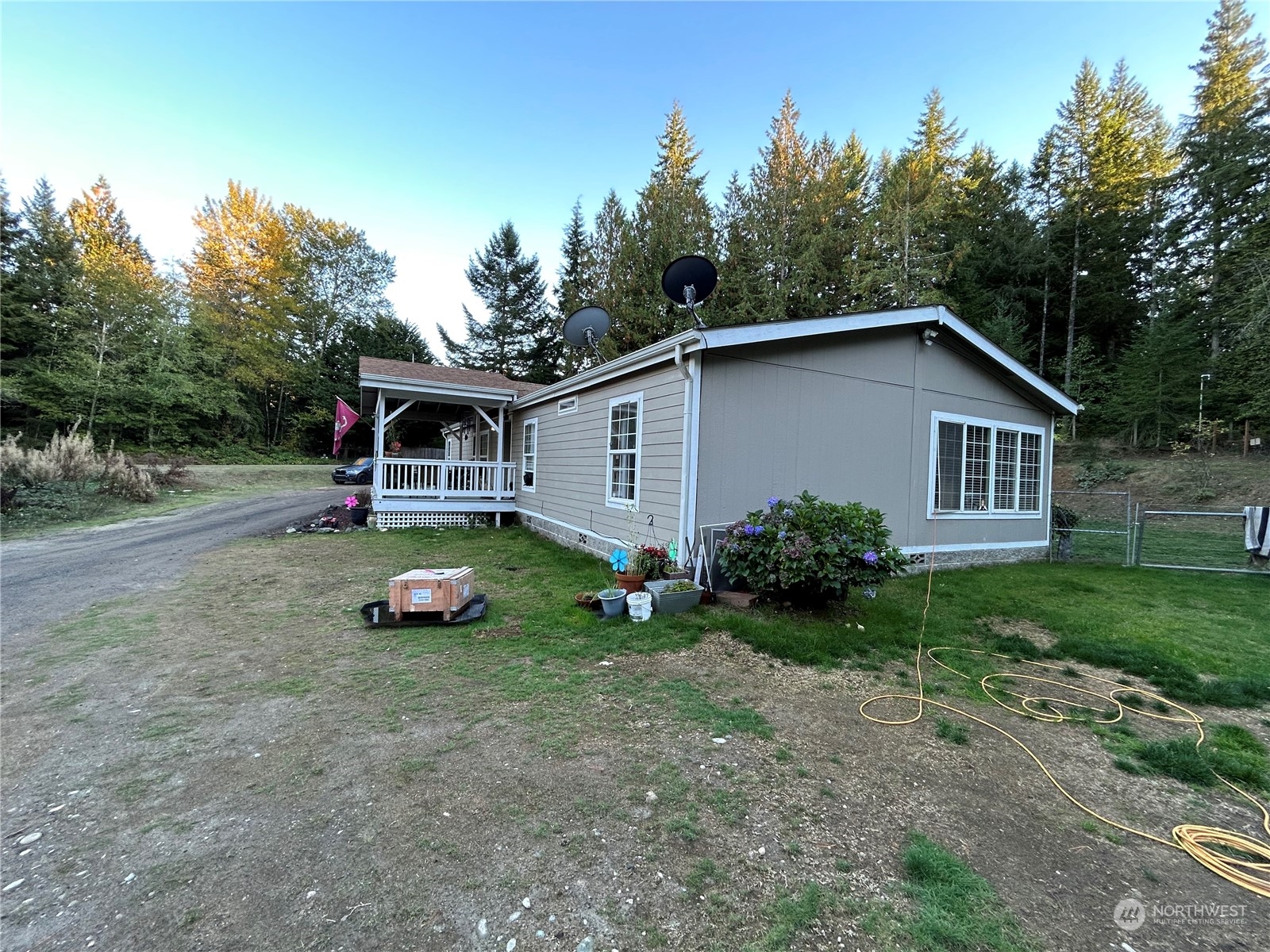 9342 Phillips Road Southeast Port Orchard, WA 98367 - Photo 2 of 12 a view of a house with backyard space and garden