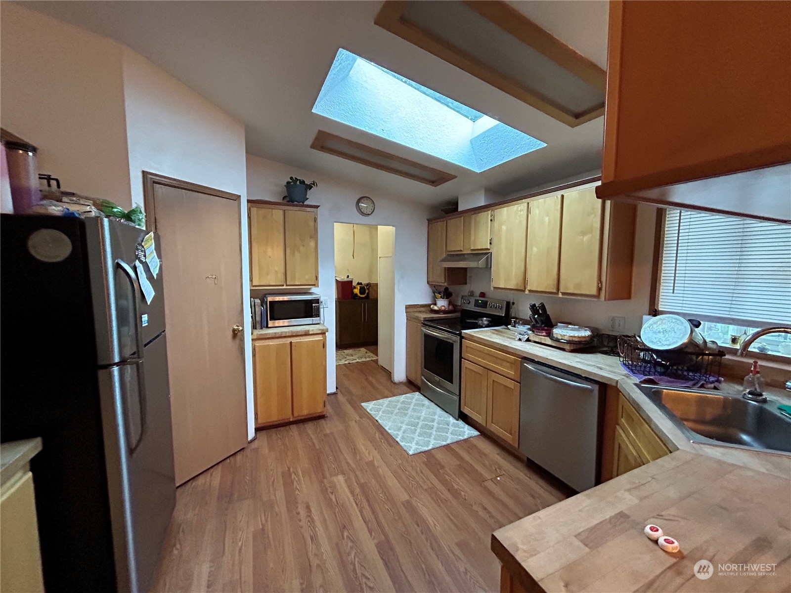 9342 Phillips Road Southeast Port Orchard, WA 98367 - Photo 7 of 12 a kitchen with stainless steel appliances a refrigerator and a stove