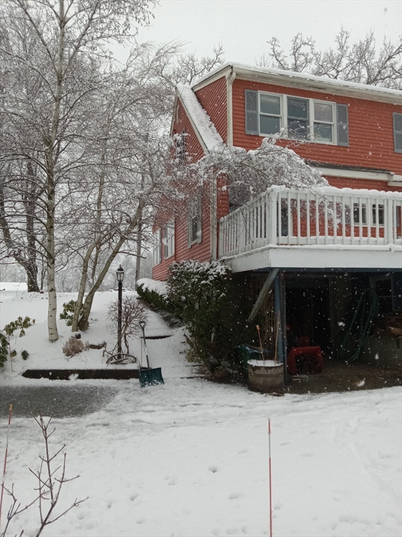 207 Topsfield Road Wenham, MA 01984 - Photo 18 of 18 a front view of a house with a yard