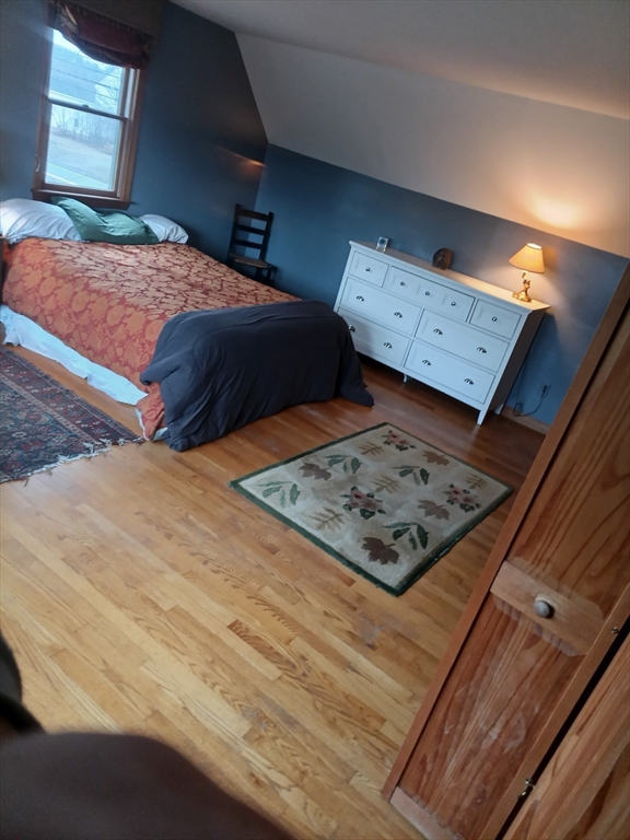 207 Topsfield Road Wenham, MA 01984 - Photo 4 of 18 a bedroom with a bed and a night stand