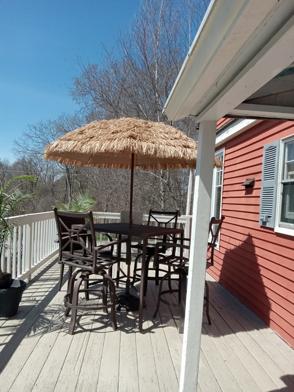 207 Topsfield Road Wenham, MA 01984 - Photo 6 of 18 a patio with wooden floor and outdoor seating