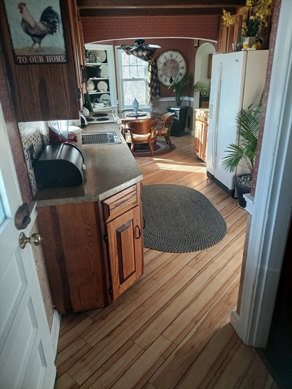 207 Topsfield Road Wenham, MA 01984 - Photo 8 of 18 a view of kitchen with a sink and wooden floor