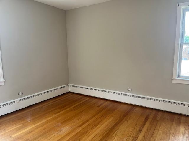 6100 South Kenneth Avenue, Unit 2 Chicago, IL 60629 - Photo 11 of 14 a view of a room with wooden floor and window