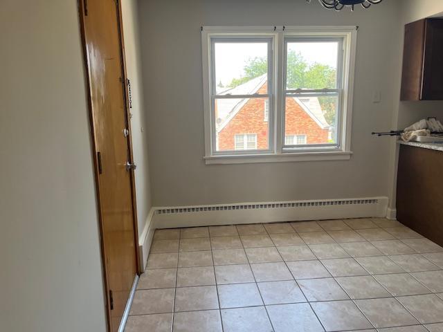 6100 South Kenneth Avenue, Unit 2 Chicago, IL 60629 - Photo 6 of 14 a view of an empty room with a window