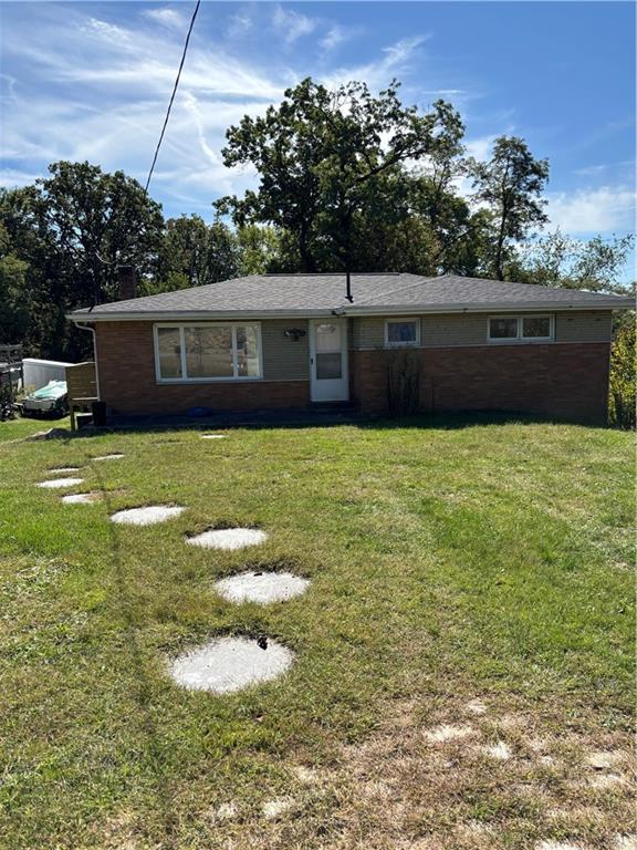 a swimming pool with outdoor seating and yard