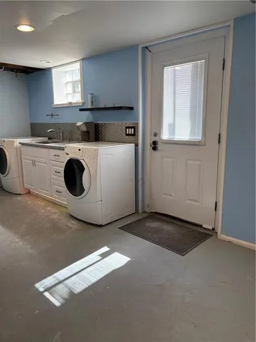 a view of a kitchen with washer and dryer