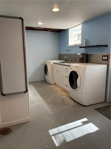 a view of a storage & utility room with a window