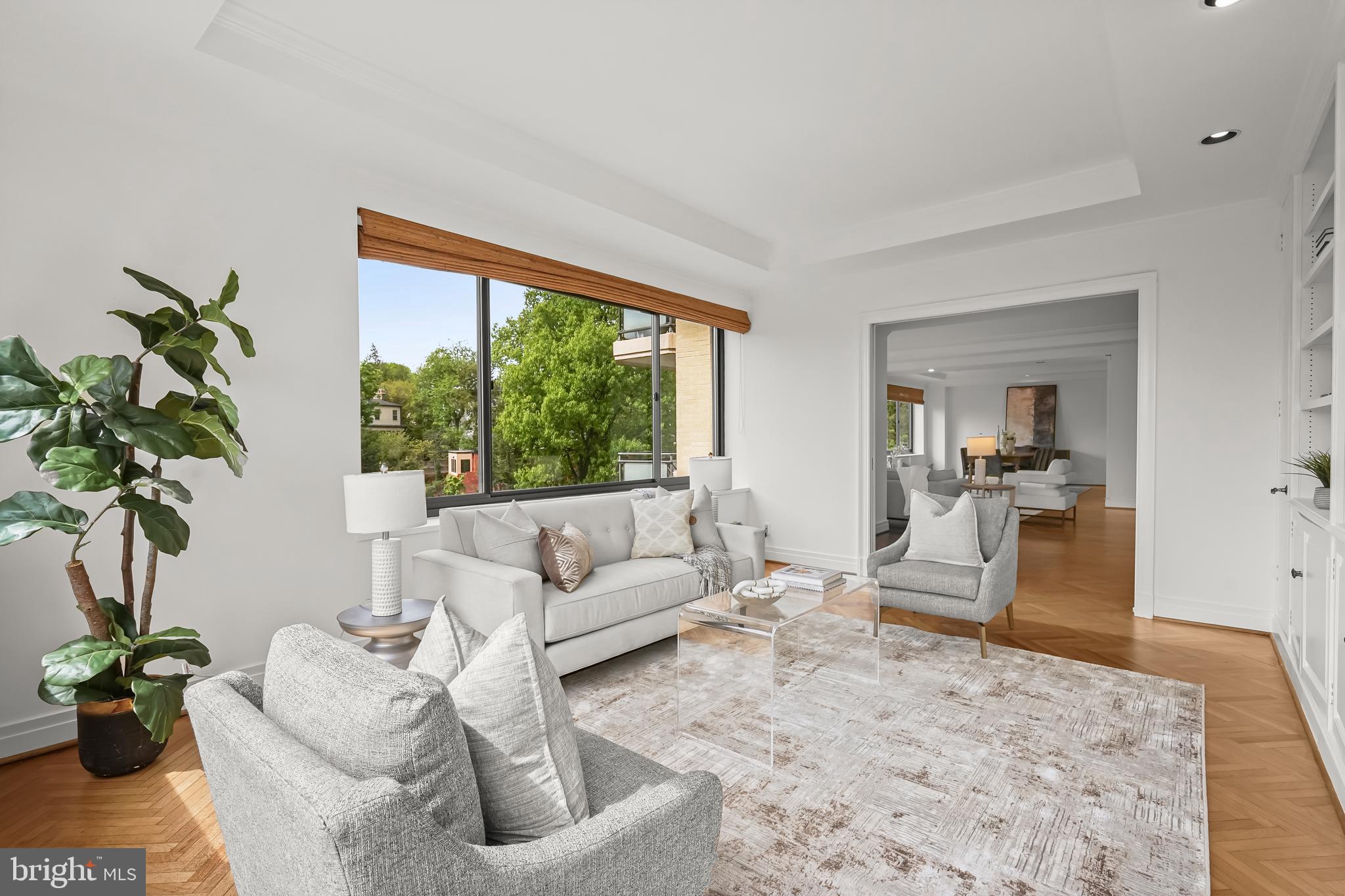2700 Calvert Street Northwest, Unit 416 Washington, DC 20008 - Photo 12 of 33 a living room with furniture potted plant and a large window
