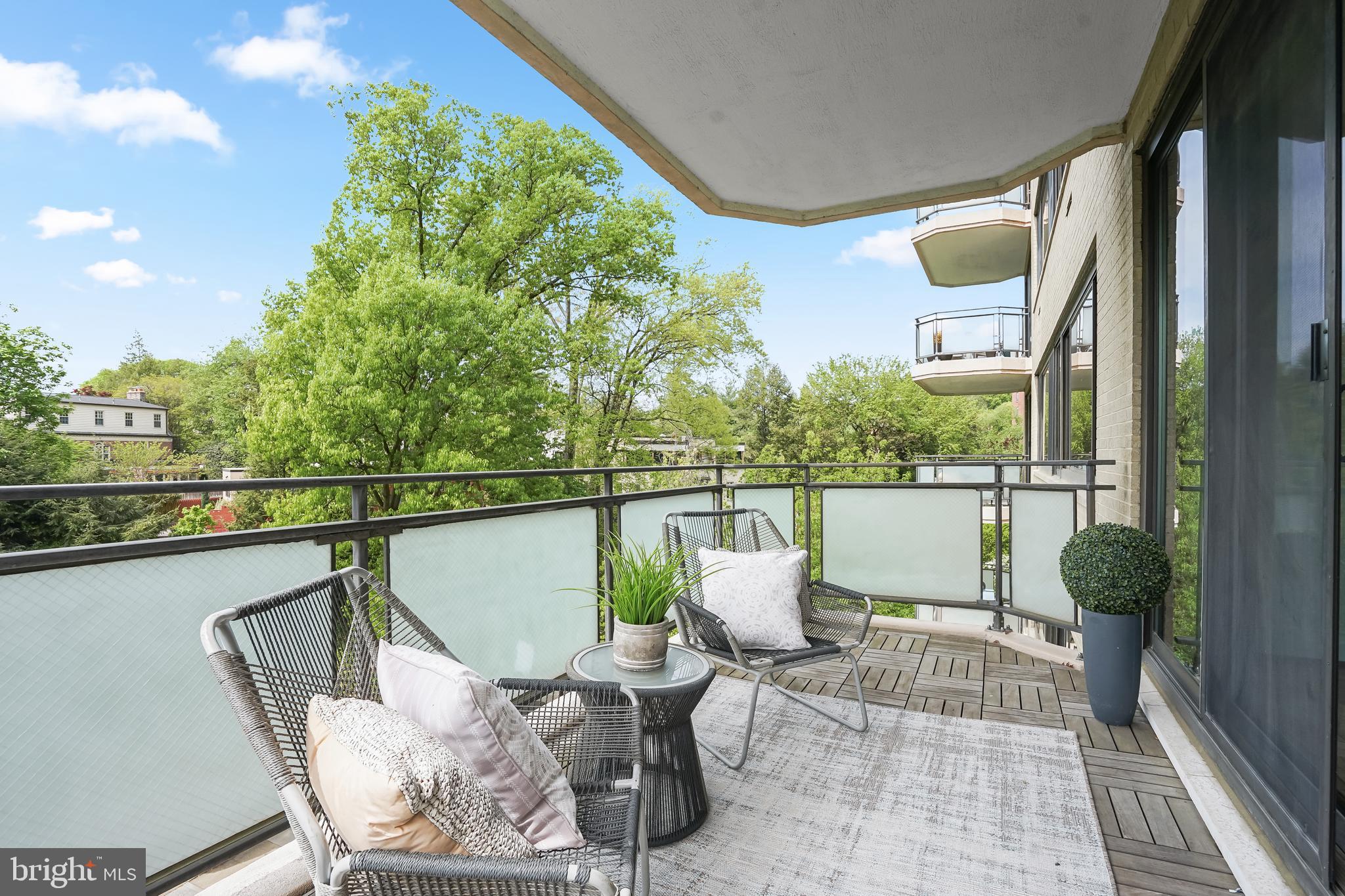 2700 Calvert Street Northwest, Unit 416 Washington, DC 20008 - Photo 15 of 33 a view of a balcony with chair and wooden floor