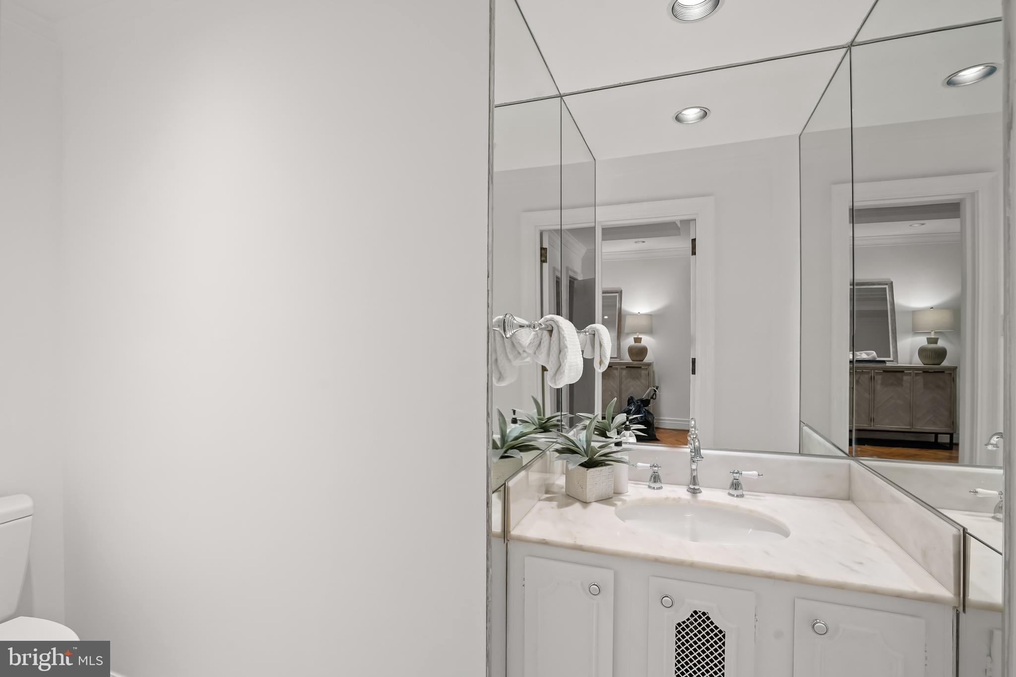 2700 Calvert Street Northwest, Unit 416 Washington, DC 20008 - Photo 16 of 33 a bathroom with a sink and a mirror
