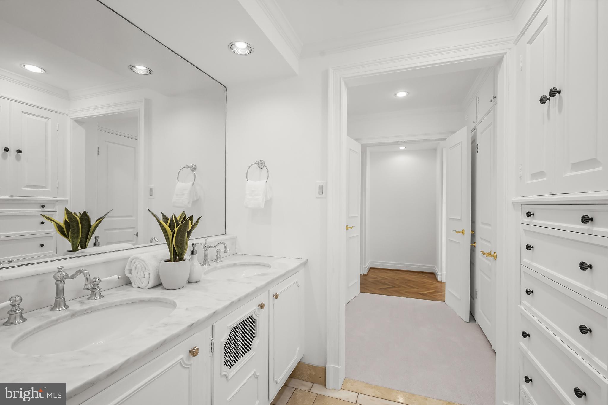 2700 Calvert Street Northwest, Unit 416 Washington, DC 20008 - Photo 23 of 33 a bathroom with a granite countertop sink mirror and a