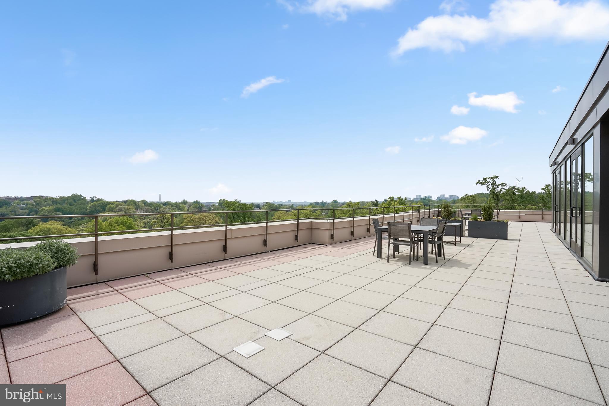 2700 Calvert Street Northwest, Unit 416 Washington, DC 20008 - Photo 26 of 33 a view of a terrace with chairs and a table
