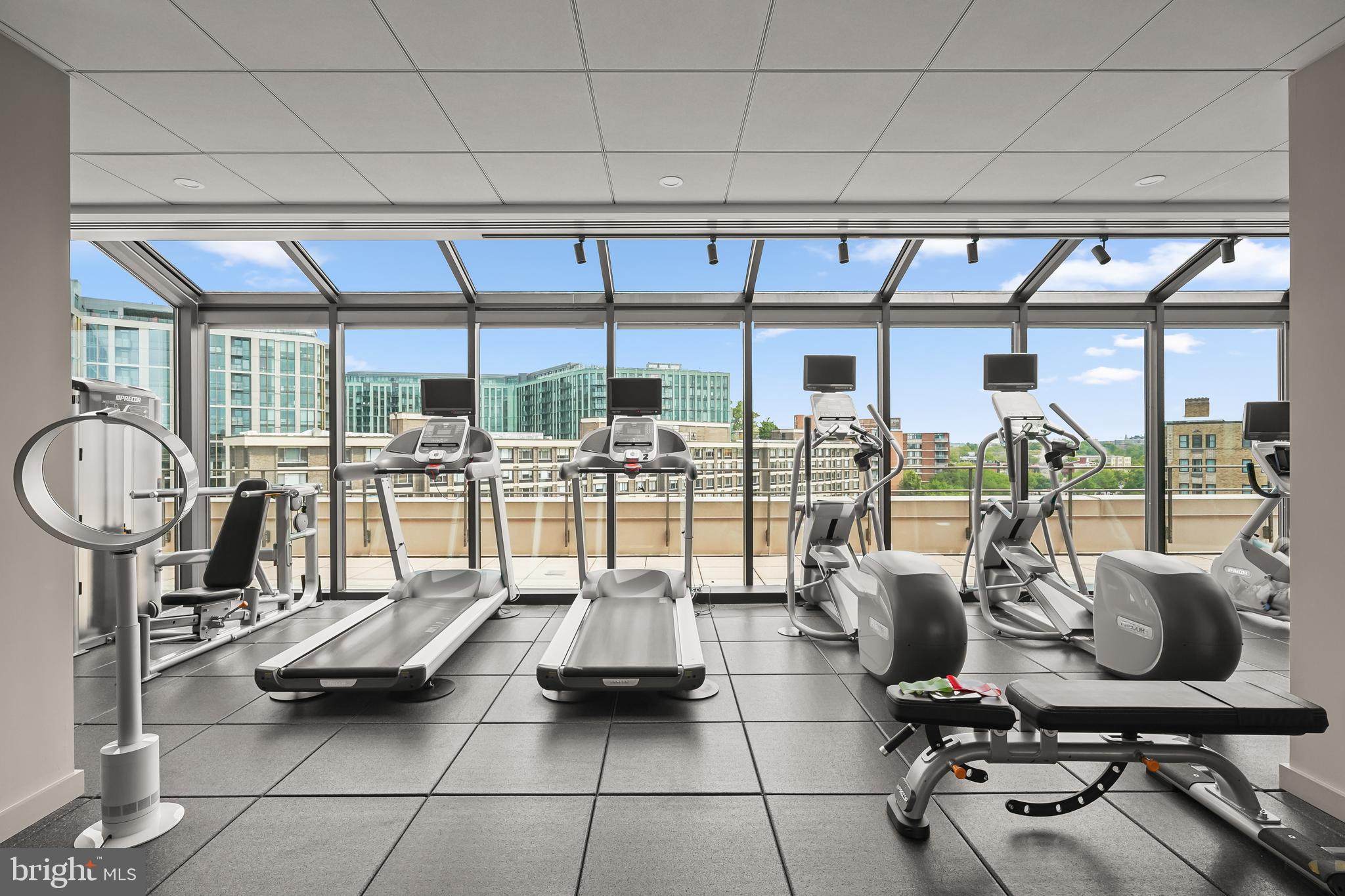 2700 Calvert Street Northwest, Unit 416 Washington, DC 20008 - Photo 29 of 33 a gym with lots of table and chairs