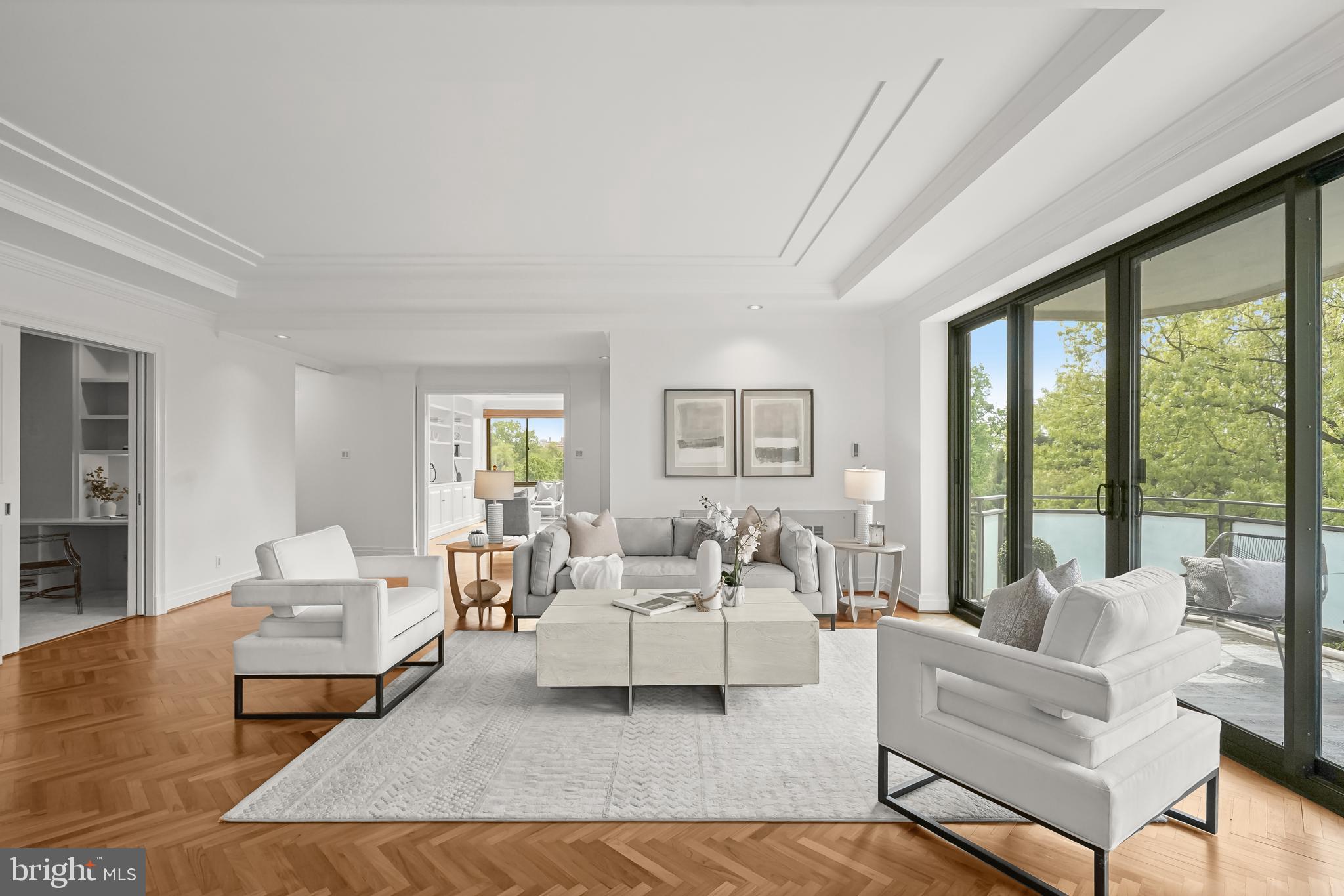 2700 Calvert Street Northwest, Unit 416 Washington, DC 20008 - Photo 5 of 33 a living room with furniture large window and a table