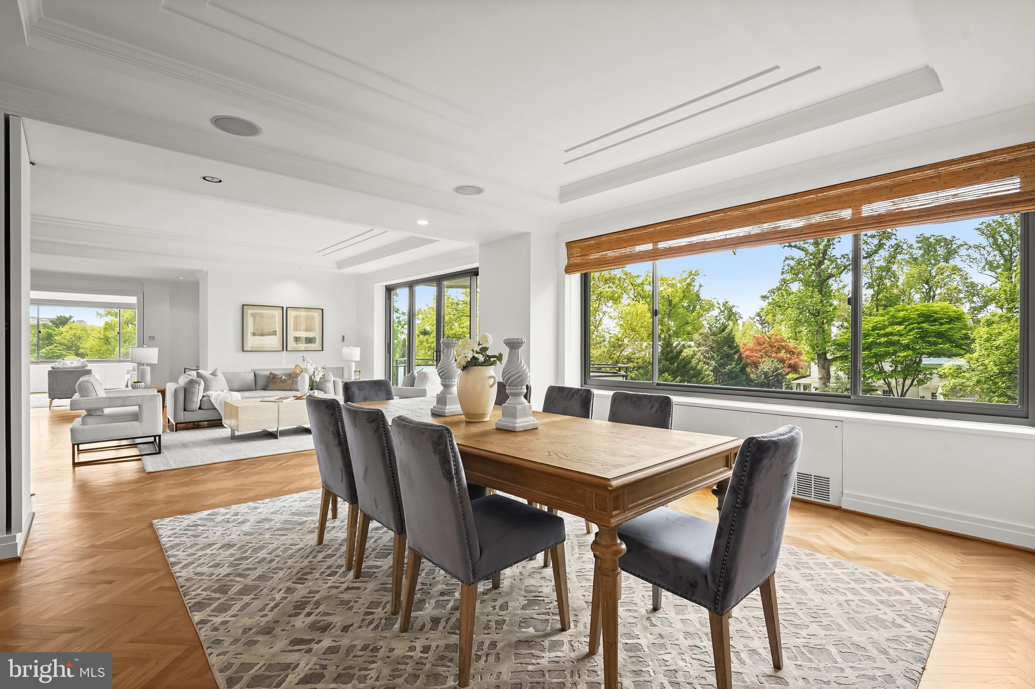 2700 Calvert Street Northwest, Unit 416 Washington, DC 20008 - Photo 8 of 33 a view of a dining room with furniture window and wooden floor