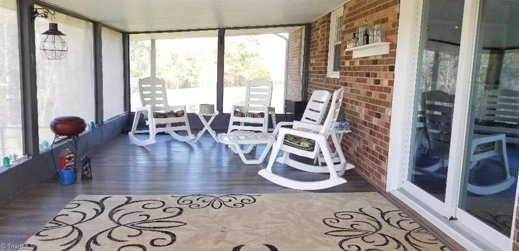 2452 Collinstown Road Stuart, VA 24171 - Photo 26 of 49 Beautiful Screened Porch w/ Vinyl Plank Flooring and Solar Screen