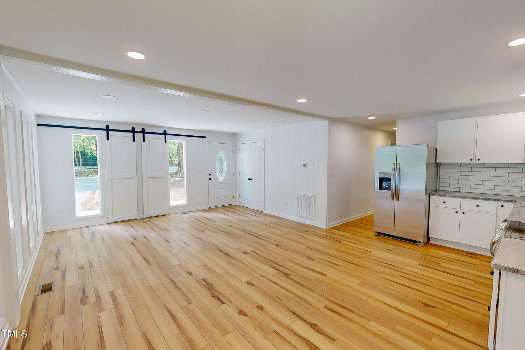 9614 Quail Roost Road Bahama, NC 27503 - Photo 4 of 40 a view of empty room with wooden floor and windows