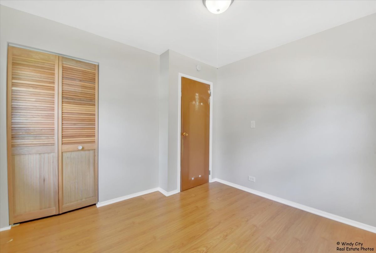 383 Raupp Boulevard Buffalo Grove, IL 60089 - Photo 13 of 40 a view of an empty room with closet and a window