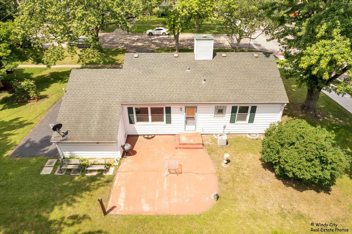 383 Raupp Boulevard Buffalo Grove, IL 60089 - Photo 27 of 40 a house view with a swimming pool