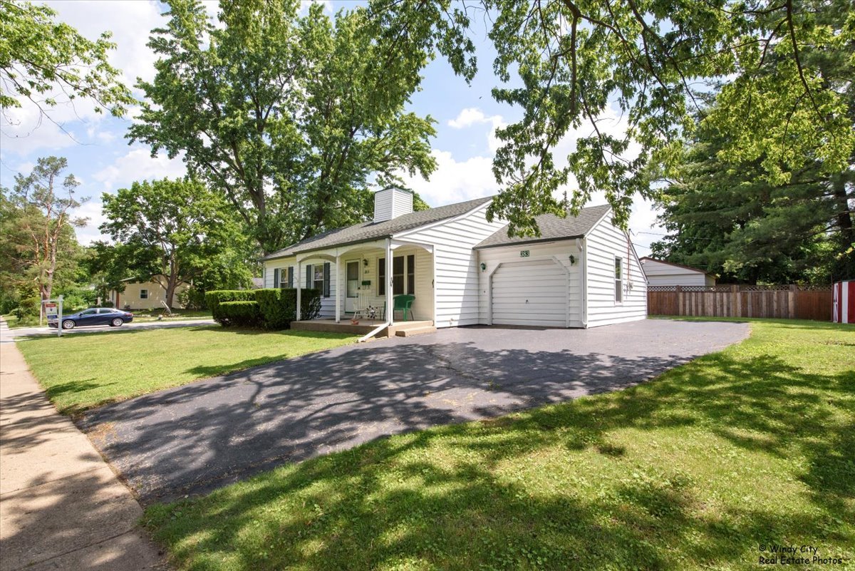 383 Raupp Boulevard Buffalo Grove, IL 60089 - Photo 36 of 40 a view of a house with backyard and trees