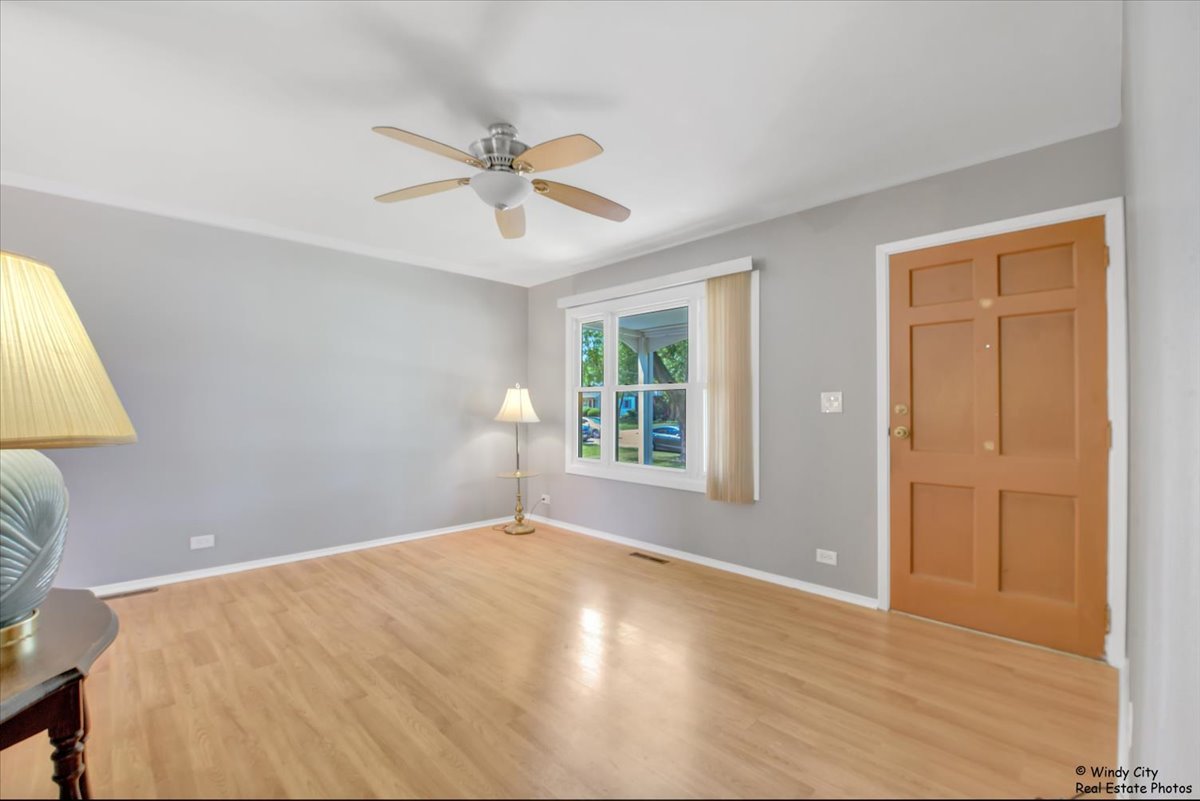 383 Raupp Boulevard Buffalo Grove, IL 60089 - Photo 4 of 40 a view of an empty room with a window