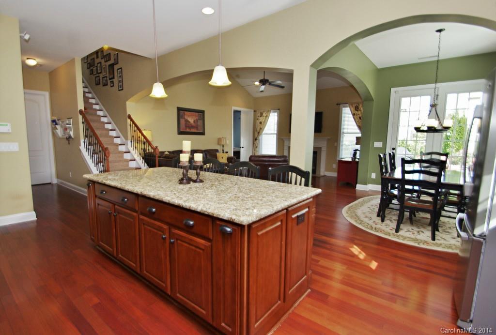 1010 Hamil Ridge Drive, Unit 929 Waxhaw, NC 28173 - Photo 2 of 24 a kitchen with counter space dining table and chairs