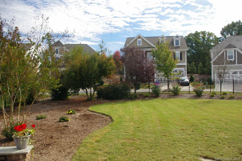 1010 Hamil Ridge Drive, Unit 929 Waxhaw, NC 28173 - Photo 6 of 24 a view of a lake with a house in the background
