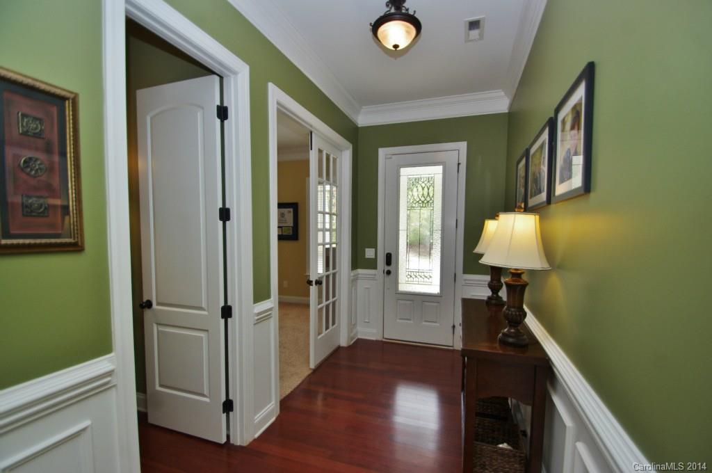 1010 Hamil Ridge Drive, Unit 929 Waxhaw, NC 28173 - Photo 7 of 24 a view of a hallway with wooden floor and entryway