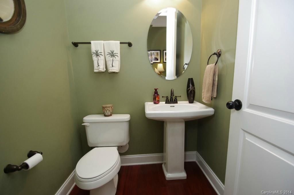 1010 Hamil Ridge Drive, Unit 929 Waxhaw, NC 28173 - Photo 9 of 24 a bathroom with a toilet sink and mirror