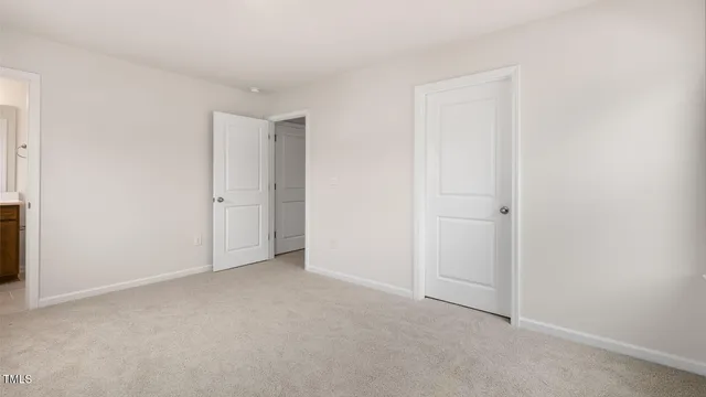 a bathroom with a sink toilet vanity and shower