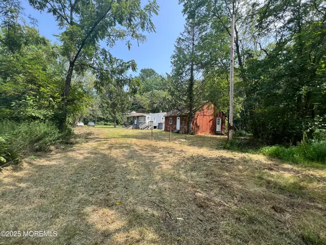 a view of a yard with an outdoor space