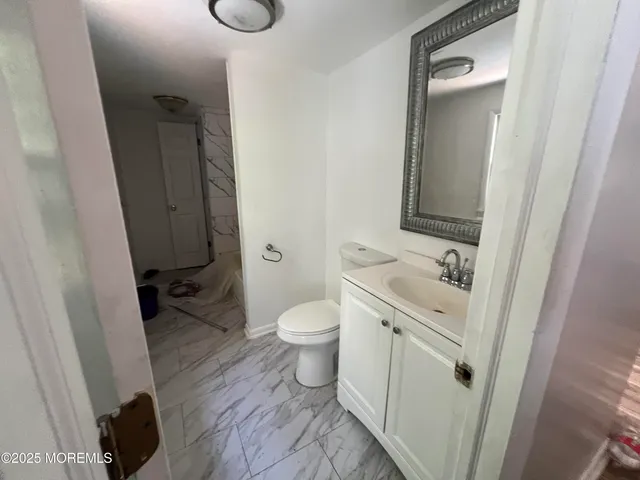 a bathroom with a bathtub and shower
