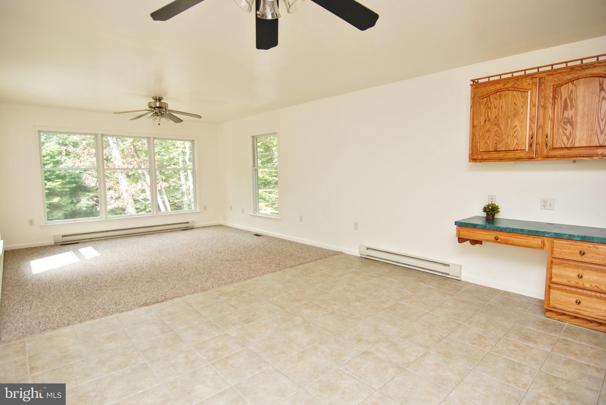 5902 Moser Road Boonsboro, MD 21713 - Photo 11 of 37 And a convenient desk area with more cabinets.