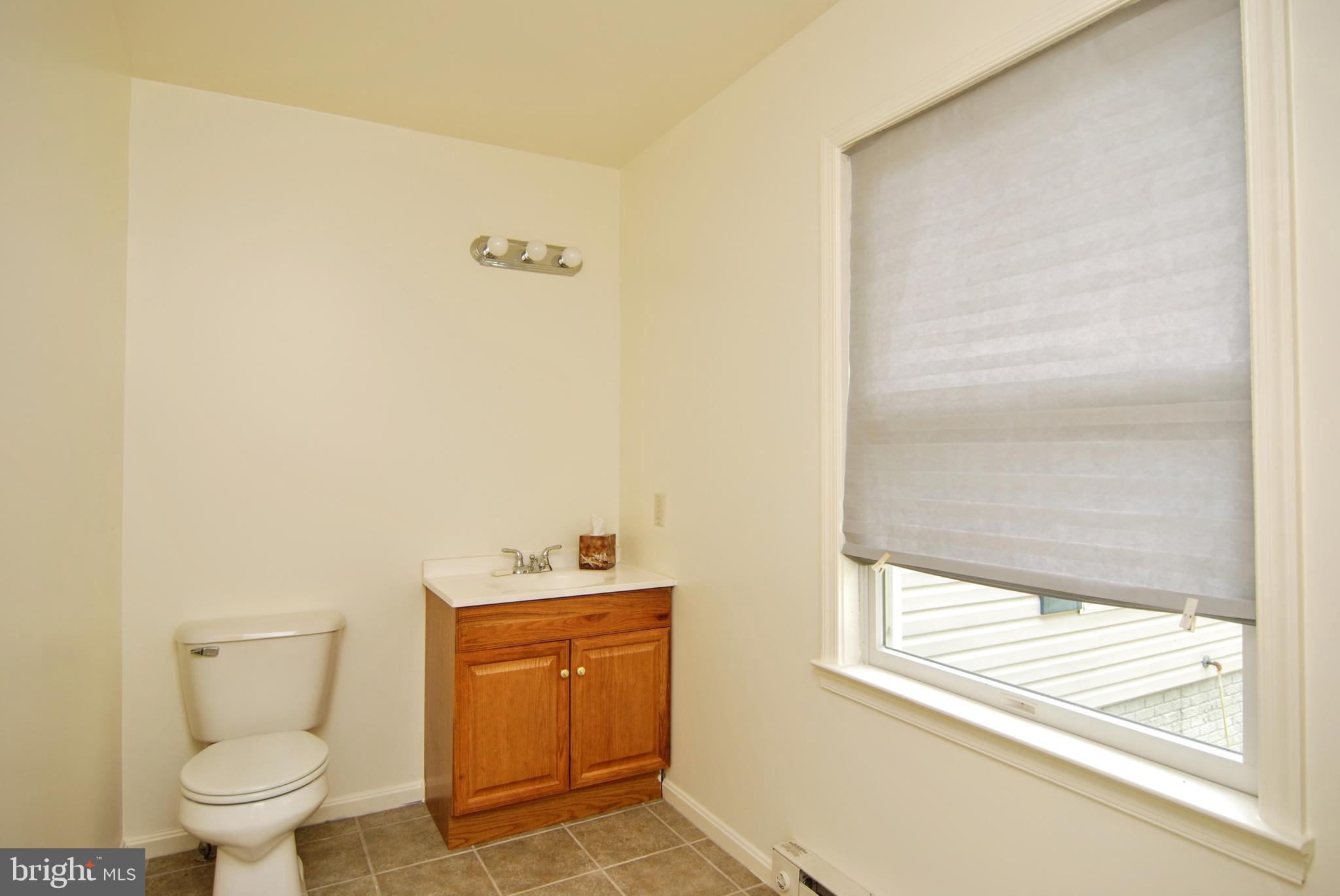 5902 Moser Road Boonsboro, MD 21713 - Photo 30 of 37 There is a convienent half bath by the side door.