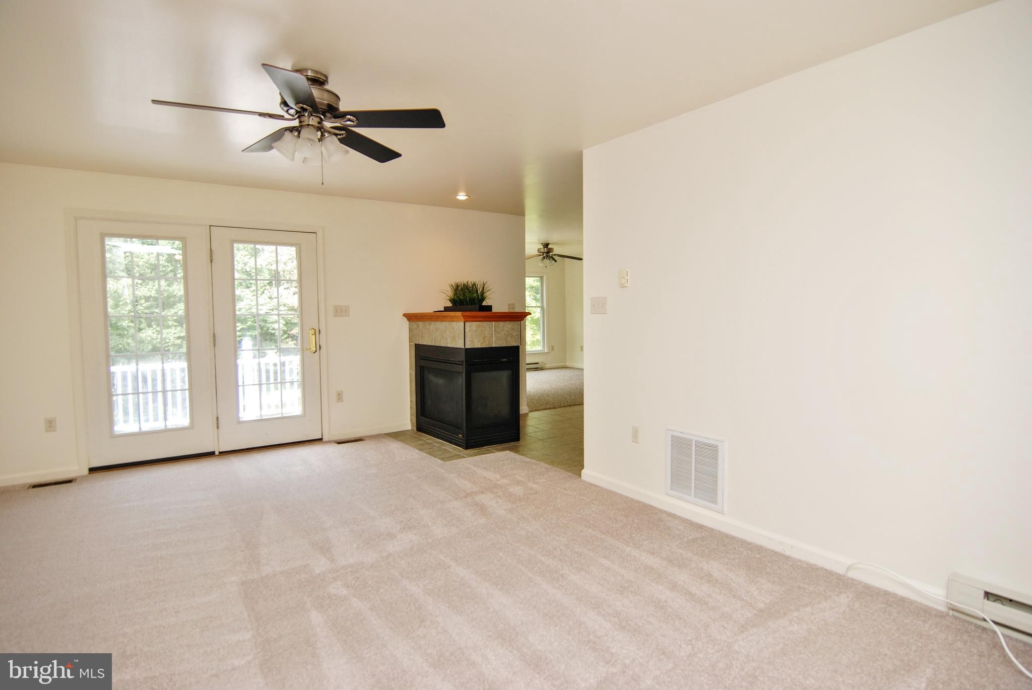5902 Moser Road Boonsboro, MD 21713 - Photo 6 of 37 The living carpet is brand new and neutral.