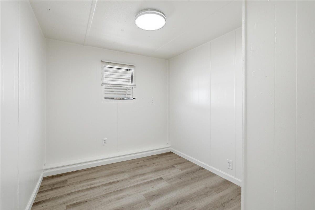 1525 Cold Springs Road, Unit 48 Placerville, CA 95667 - Photo 10 of 23 an empty room with wooden floor and windows