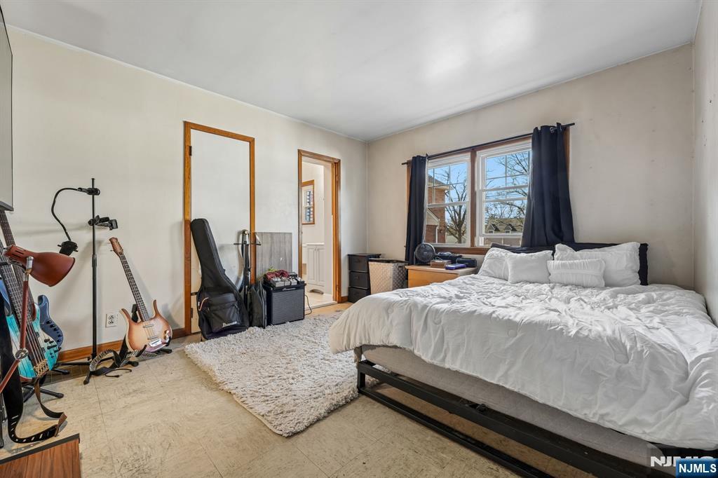 140 Francisco Avenue Rutherford, NJ 07070 - Photo 12 of 25 a bedroom with a bed and wooden floor