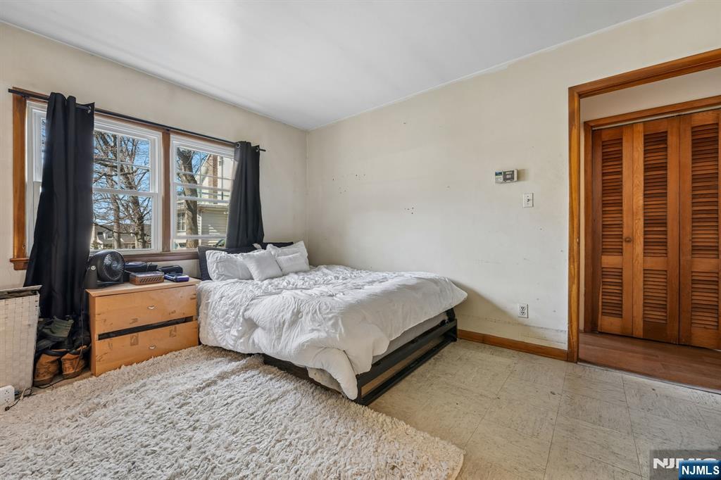 140 Francisco Avenue Rutherford, NJ 07070 - Photo 13 of 25 a spacious bedroom with a bed and a large window