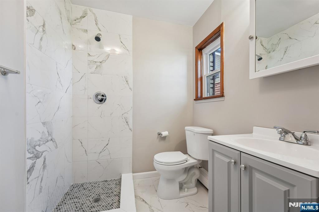 140 Francisco Avenue Rutherford, NJ 07070 - Photo 15 of 25 a bathroom with a toilet sink and shower