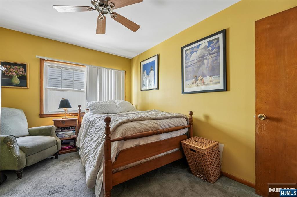 140 Francisco Avenue Rutherford, NJ 07070 - Photo 17 of 25 a bedroom with a bed and a couch