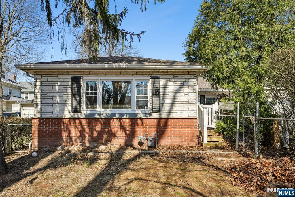 140 Francisco Avenue Rutherford, NJ 07070 - Photo 2 of 25 a view of a house with a large window and yard